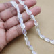 Glass Beads 9mm Oval Twisted Faceted - Clear & Lustre - 1 String / 30 Beads